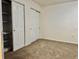 Comfortable bedroom featuring a closet with shelves, sliding door closet and neutral carpeting at 5501 80Th N St # 509, St Petersburg, FL 33709