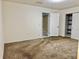 A bedroom offering plush carpeting, neutral paint and open closet with shelving at 5501 80Th N St # 509, St Petersburg, FL 33709