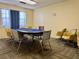Card room with table and chairs; a great community space for social gatherings and game nights at 5501 80Th N St # 509, St Petersburg, FL 33709