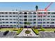 Well-maintained condo complex featuring lush landscaping, mature palm trees, and ample parking at 5501 80Th N St # 509, St Petersburg, FL 33709