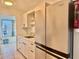 Bright kitchen with granite countertops, stainless steel appliances, and modern refrigerator at 5501 80Th N St # 509, St Petersburg, FL 33709