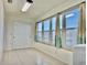Functional laundry space with tiled floor and large windows offering plenty of natural light at 5501 80Th N St # 509, St Petersburg, FL 33709