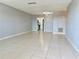 Bright living room with tile floors offering an easy flow into the kitchen at 5501 80Th N St # 509, St Petersburg, FL 33709