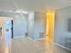 Inviting living room area showcasing the neutral paint, tile flooring, and easy access to the kitchen at 5501 80Th N St # 509, St Petersburg, FL 33709