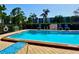 Community pool offers a refreshing escape with clear blue water, lounge chairs, and well-kept surroundings at 5501 80Th N St # 509, St Petersburg, FL 33709