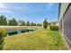 Spacious backyard with a scenic pond and lush landscaping at 5710 Grand Sonata Ave, Lutz, FL 33558