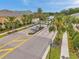 Aerial view of the community entrance, showcasing well-manicured landscaping and charming residential homes at 5710 Grand Sonata Ave, Lutz, FL 33558