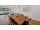 Comfortable dining area adjacent to a living room space with a beautiful natural light, and hardwood flooring at 5710 Grand Sonata Ave, Lutz, FL 33558