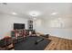 Bright home gym features workout equipment, recessed lighting, and wood-look flooring at 5710 Grand Sonata Ave, Lutz, FL 33558