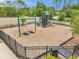 The fenced playground includes swings, slides, climbing, and play areas for children in a secure and fun environment at 5710 Grand Sonata Ave, Lutz, FL 33558