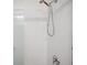 Walk-in shower featuring a rainfall showerhead and stylish fixtures at 5710 Grand Sonata Ave, Lutz, FL 33558