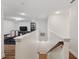 Interior staircase leading to a recreational area with gym equipment and a television, offering convenient access at 5710 Grand Sonata Ave, Lutz, FL 33558