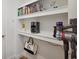 Convenient storage area with built-in shelves and stylish decor accents at 5710 Grand Sonata Ave, Lutz, FL 33558