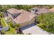 Aerial view of the home featuring a well-manicured lawn and a three-car garage at 6203 34Th E Ct, Ellenton, FL 34222
