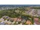 Aerial view of a suburban neighborhood with homes surrounding natural ponds and woods at 6203 34Th E Ct, Ellenton, FL 34222