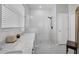 Well-lit bathroom featuring marble countertops, a walk-in shower with unique tiling, and a modern vanity at 6203 34Th E Ct, Ellenton, FL 34222
