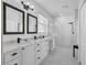 Modern bathroom featuring double sinks, a walk-in shower with unique tiling, and stylish fixtures at 6203 34Th E Ct, Ellenton, FL 34222
