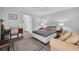 Relaxing bedroom featuring a cozy bed, seating, and charming decor at 6203 34Th E Ct, Ellenton, FL 34222