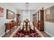 Formal dining room with hardwood furnishings, decorative rug, and natural lighting for Gathering gatherings at 6203 34Th E Ct, Ellenton, FL 34222