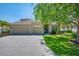 Charming one-story home with a three-car garage, lush front lawn, and mature trees at 6203 34Th E Ct, Ellenton, FL 34222