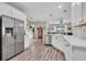 Modern kitchen features an island with bar seating, stainless steel appliances, and open layout perfect for entertaining at 6203 34Th E Ct, Ellenton, FL 34222