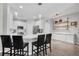 Spacious kitchen featuring bar stools at the counter, stainless steel appliances, and ample cabinet storage at 6203 34Th E Ct, Ellenton, FL 34222