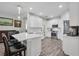 Well-lit kitchen with stainless steel appliances, a convenient island, and bar stool seating for casual dining at 6203 34Th E Ct, Ellenton, FL 34222