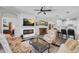 Inviting living room with a modern fireplace, open floorplan, and stylish decor at 6203 34Th E Ct, Ellenton, FL 34222