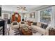 Comfortable living room featuring plush sofas, stylish decor, and ample natural light at 6203 34Th E Ct, Ellenton, FL 34222