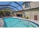 Screened in pool with covered lanai, outdoor seating, and well maintained landscaping at 6203 34Th E Ct, Ellenton, FL 34222