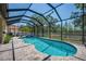 Enjoy the Florida lifestyle in this stunning screened-in pool and spa area with paved deck at 6203 34Th E Ct, Ellenton, FL 34222