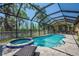 Beautiful screened in pool and spa with blue mosaic tile and brick paver patio at 6203 34Th E Ct, Ellenton, FL 34222