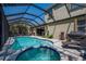 Beautiful pool and spa with blue mosaic tile, covered lanai and well maintained landscaping at 6203 34Th E Ct, Ellenton, FL 34222