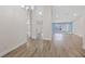 Bright living room with modern flooring, high ceilings, and light blue accent wall at 6501 Appaloosa Dr, Tampa, FL 33625