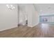 Bright living room with modern flooring, high ceilings, and light blue accent wall at 6501 Appaloosa Dr, Tampa, FL 33625