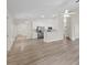 Bright living room open to the modern kitchen with stainless steel appliances and breakfast bar at 6501 Appaloosa Dr, Tampa, FL 33625