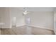 Bright living room with modern flooring, ceiling fan, and lots of natural light at 6501 Appaloosa Dr, Tampa, FL 33625