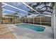 In-ground swimming pool with screened enclosure and brick paver patio at 6501 Appaloosa Dr, Tampa, FL 33625