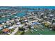 Aerial view of a home on a waterway, with a private dock and quick access to the bay at 712 Sunset Cv, Madeira Beach, FL 33708