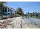 Waterfront property with beach, dock, and easy access to the water at 712 Sunset Cv, Madeira Beach, FL 33708