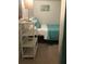 Cozy bedroom featuring a single bed, wicker shelving, and peaceful beach-themed decor for a relaxing stay at 712 Sunset Cv, Madeira Beach, FL 33708