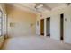 Bedroom featuring neutral walls, closet, and a ceiling fan at 712 Sunset Cv, Madeira Beach, FL 33708