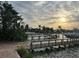 Beautiful waterfront view of a private dock and boat, set against a tranquil, scenic backdrop at 712 Sunset Cv, Madeira Beach, FL 33708