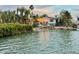 Waterfront property featuring a private dock and easy access to the water at 712 Sunset Cv, Madeira Beach, FL 33708