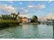 Waterfront home with lush landscaping and private dock in a tranquil setting at 712 Sunset Cv, Madeira Beach, FL 33708