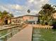 Waterfront property featuring a charming two-story home and private dock at 712 Sunset Cv, Madeira Beach, FL 33708