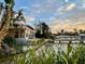 Waterfront home featuring a private dock and serene water views at 712 Sunset Cv, Madeira Beach, FL 33708