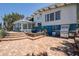 Back exterior featuring a custom grill area, decorative fountain, and an enclosed lanai at 712 Sunset Cv, Madeira Beach, FL 33708
