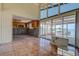 Partially renovated living room with water views, tile floors, and wooden cabinets at 712 Sunset Cv, Madeira Beach, FL 33708