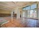 Open concept living room featuring high ceilings, large windows and tile flooring at 712 Sunset Cv, Madeira Beach, FL 33708